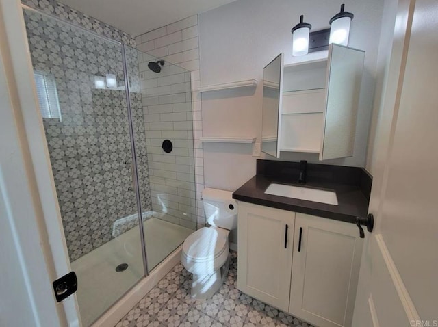 bathroom with vanity, tile patterned floors, a shower stall, and toilet