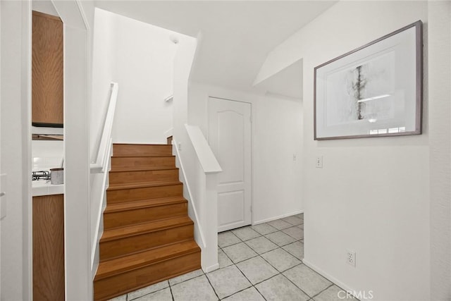 stairway featuring tile patterned floors