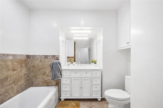 bathroom featuring a garden tub, tile patterned floors, toilet, and vanity