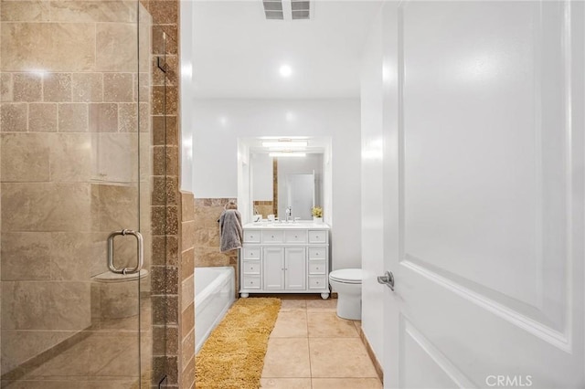 full bathroom featuring visible vents, vanity, toilet, a bath, and a stall shower