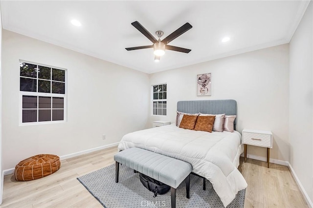 bedroom with light wood-type flooring, recessed lighting, and baseboards