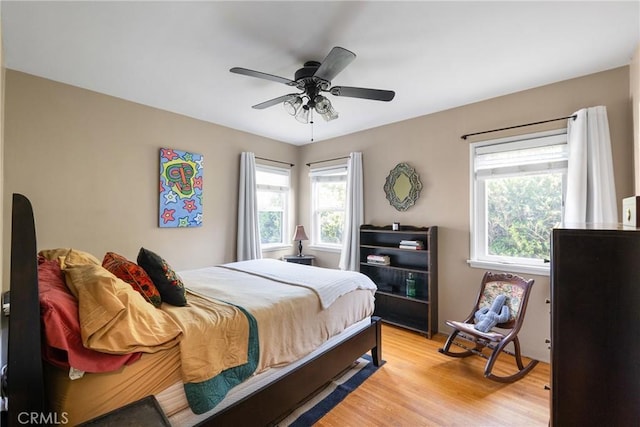 bedroom featuring a ceiling fan and light wood-type flooring