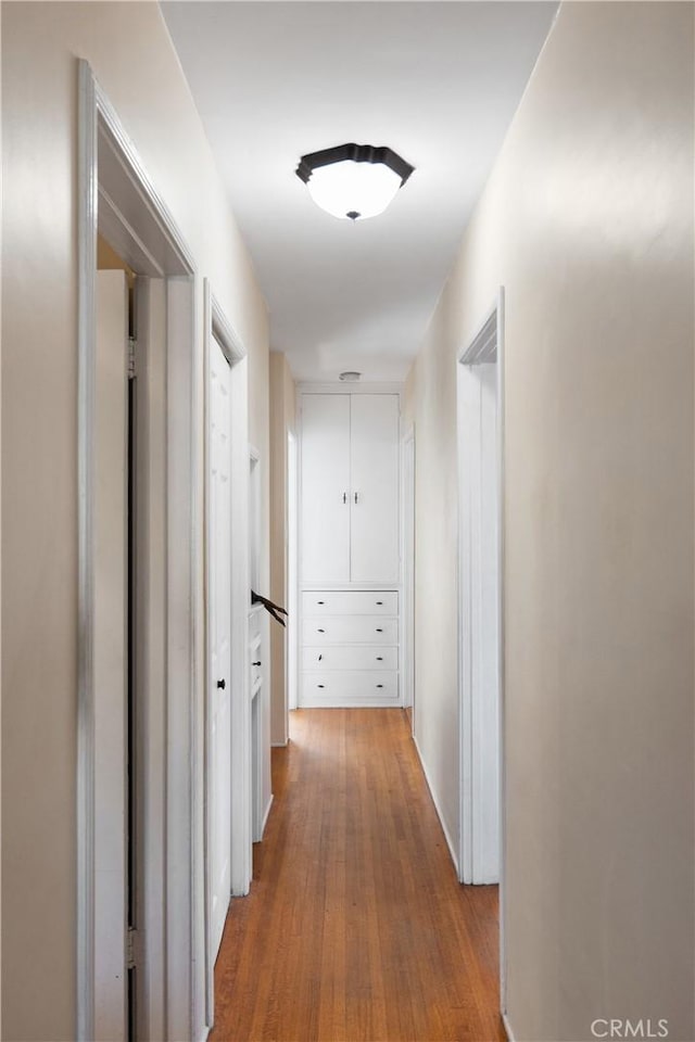 hallway with wood finished floors