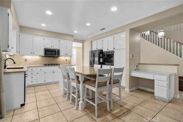 4677 Willow Bend Ct, Chino Hills, CA 91709 - kitchen with crown molding, decorative backsplash, white cabinets, a sink, and stainless steel appliances