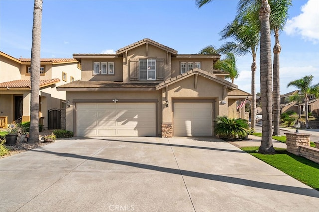 4677 Willow Bend Ct, Chino Hills, CA 91709 - view of front facade with concrete driveway, a tiled roof, an attached garage, and stucco siding