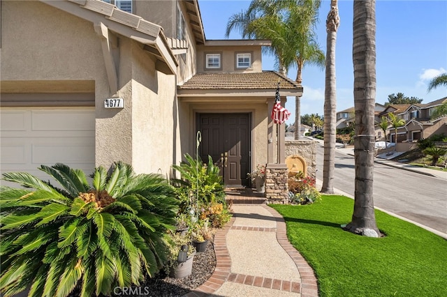 4677 Willow Bend Ct, Chino Hills, CA 91709 - view of exterior entry with stucco siding and an attached garage