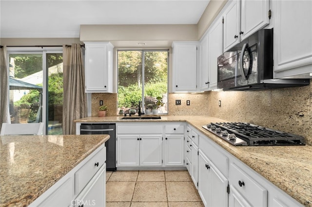 4677 Willow Bend Ct, Chino Hills, CA 91709 - kitchen featuring white cabinets, appliances with stainless steel finishes, light stone counters, a sink, and backsplash