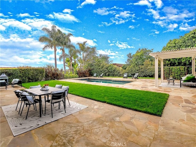 view of patio featuring a fenced in pool, a pergola, and outdoor dining space