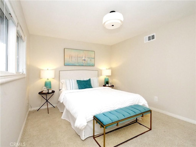 bedroom with visible vents, baseboards, and carpet floors