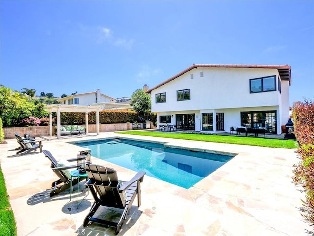 view of swimming pool with a fenced in pool, fence, and a patio