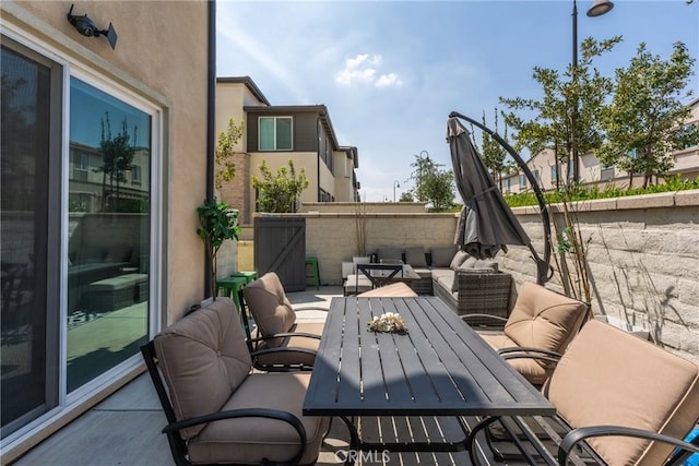 view of patio with fence and an outdoor living space
