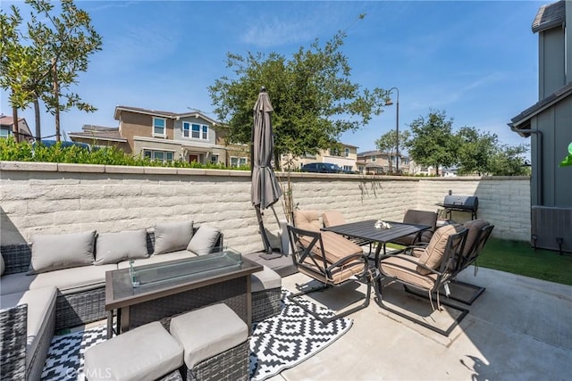 view of patio / terrace with outdoor dining area and an outdoor hangout area