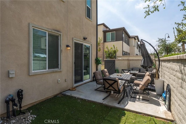 view of patio featuring fence