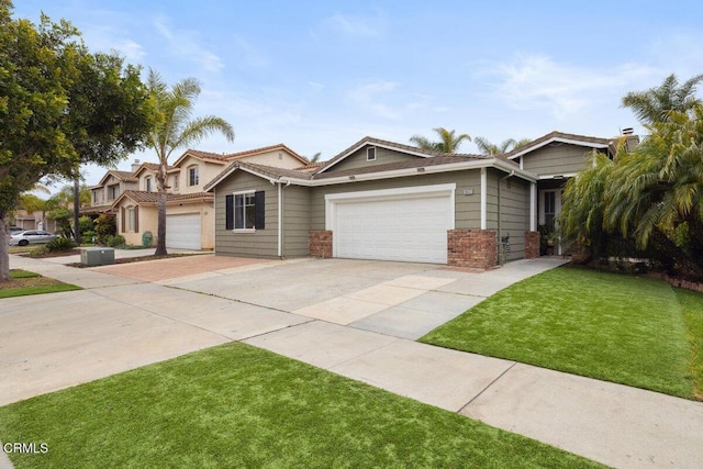 view of front of house with a garage, driveway, a front lawn, and brick siding