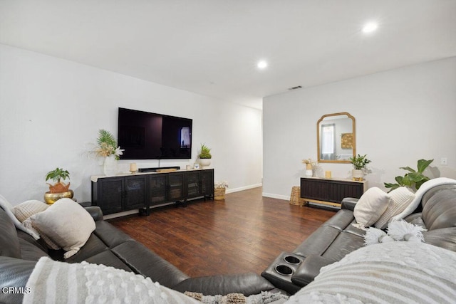 living area featuring recessed lighting, baseboards, visible vents, and wood finished floors