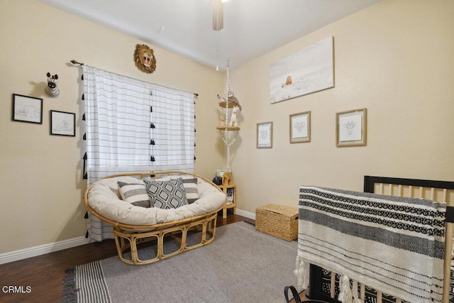 bedroom featuring baseboards, a ceiling fan, and wood finished floors