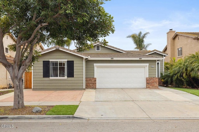 view of front of house featuring concrete driveway, brick siding, and an attached garage