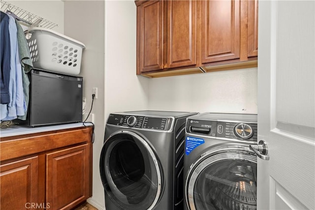 28292 N Via Sonata Dr, Valencia, CA 91354 - laundry area featuring independent washer and dryer and cabinet space