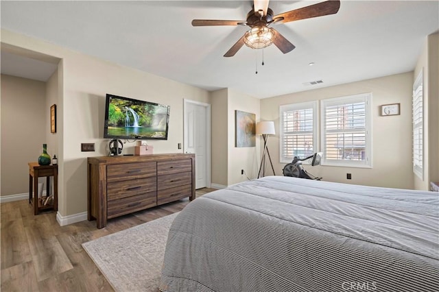 28292 N Via Sonata Dr, Valencia, CA 91354 - bedroom featuring wood finished floors, baseboards, and a ceiling fan