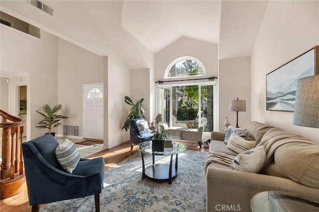 16562 Orangewind Ln, Riverside, CA 92503 - living room featuring high vaulted ceiling and wood finished floors