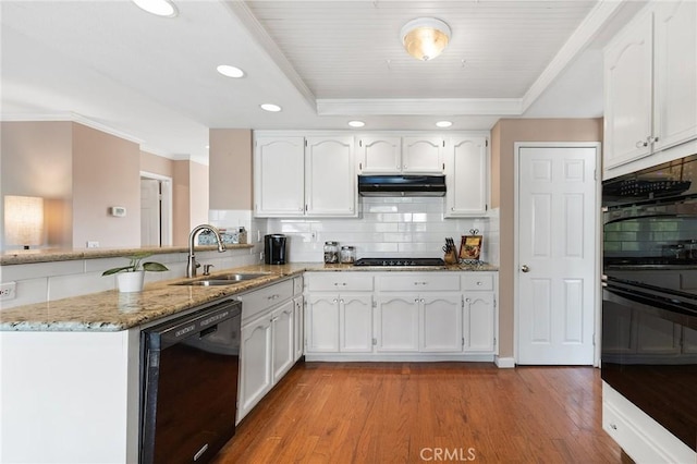 16562 Orangewind Ln, Riverside, CA 92503 - kitchen featuring black appliances, a sink, under cabinet range hood, backsplash, and white cabinetry