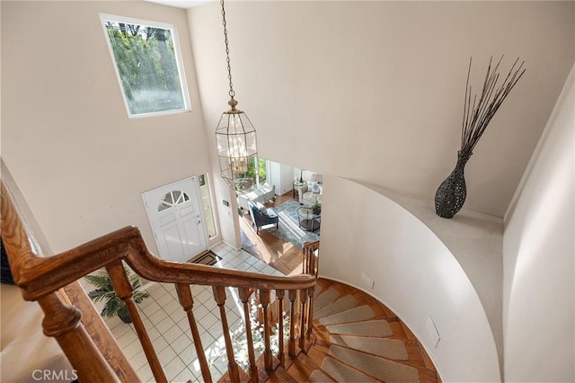 16562 Orangewind Ln, Riverside, CA 92503 - stairs featuring a chandelier and a towering ceiling