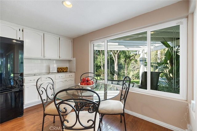 16562 Orangewind Ln, Riverside, CA 92503 - dining room featuring light wood-type flooring and baseboards