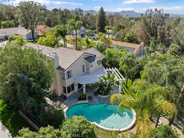 16562 Orangewind Ln, Riverside, CA 92503 - view of subject property featuring a pool area and a mountainous background