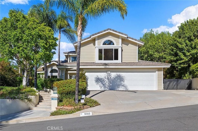 16562 Orangewind Ln, Riverside, CA 92503 - traditional-style house featuring an attached garage and driveway
