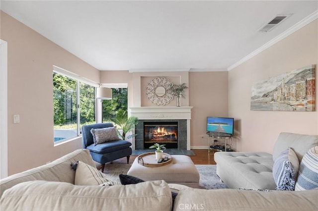 16562 Orangewind Ln, Riverside, CA 92503 - living room featuring wood finished floors, a fireplace, baseboards, and ornamental molding