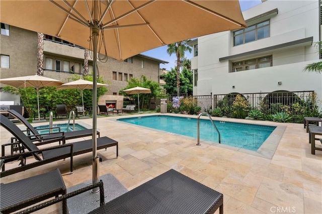 920 Granite Dr Unit 502, Pasadena, CA 91101 - pool featuring a patio, a warm lit fireplace, and fence