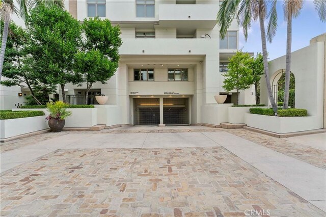920 Granite Dr Unit 502, Pasadena, CA 91101 - view of building exterior featuring a garage and driveway