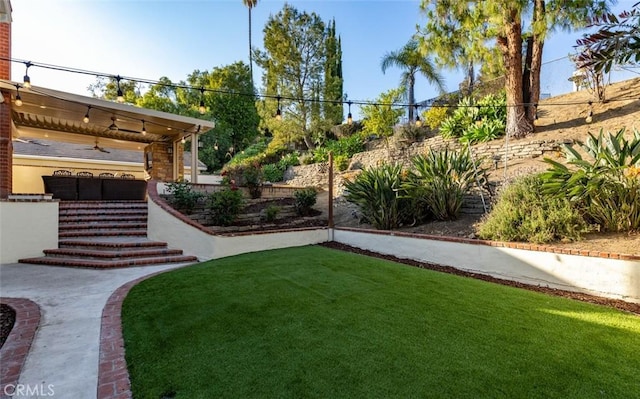 view of yard with fence and stairway