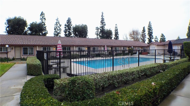 community pool featuring fence