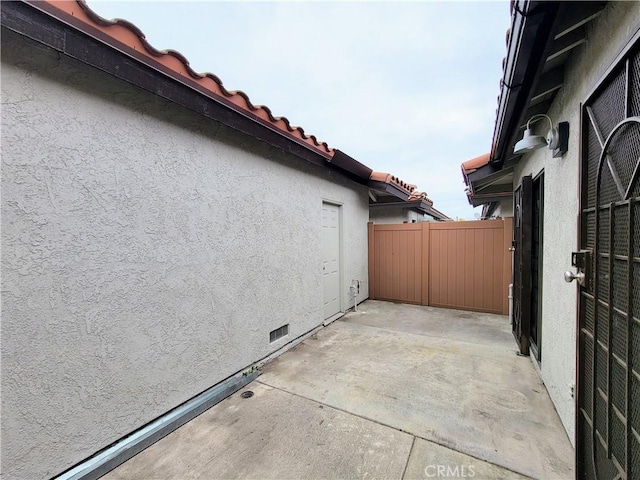 view of patio / terrace featuring fence
