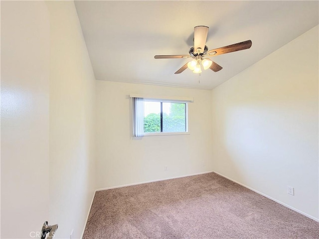 empty room featuring carpet floors, baseboards, and ceiling fan