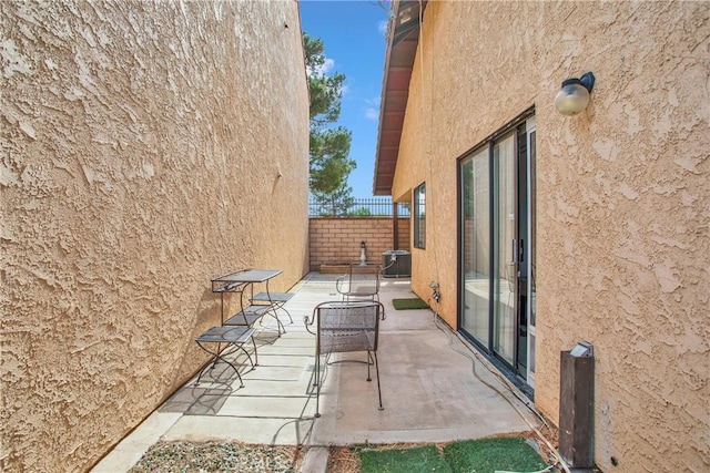 view of patio / terrace featuring fence