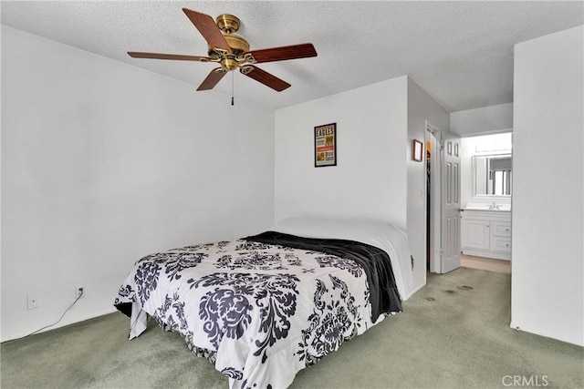 bedroom with a textured ceiling, ceiling fan, and carpet