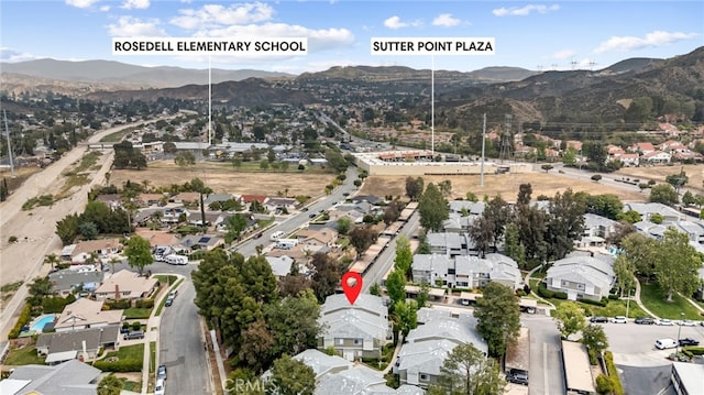 drone / aerial view with a mountain view and a residential view