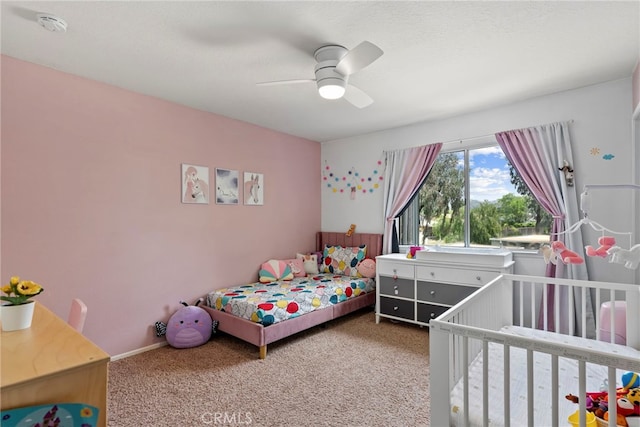 carpeted bedroom featuring a ceiling fan