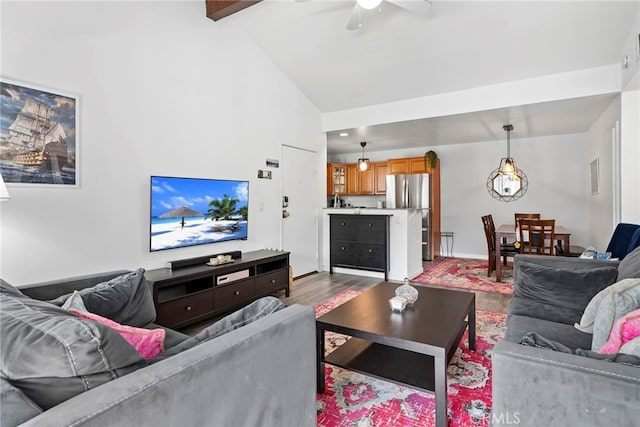living room with beamed ceiling, a ceiling fan, high vaulted ceiling, and dark wood-style floors