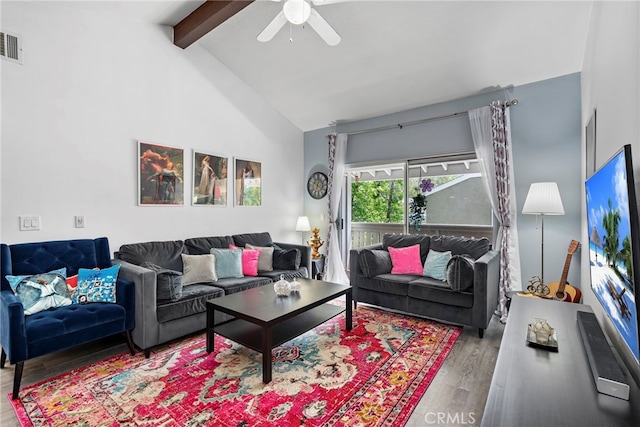 living area with visible vents, wood finished floors, beamed ceiling, ceiling fan, and high vaulted ceiling