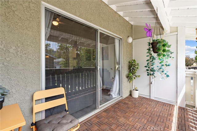 doorway to property featuring stucco siding
