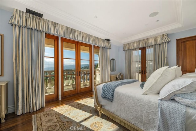 bedroom with french doors, visible vents, wood finished floors, ornamental molding, and access to outside