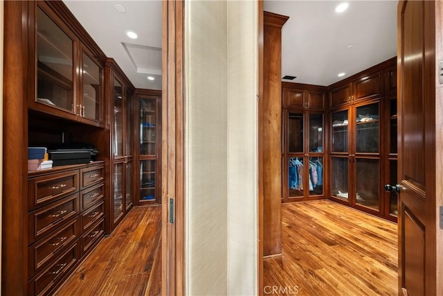hallway with recessed lighting and wood finished floors