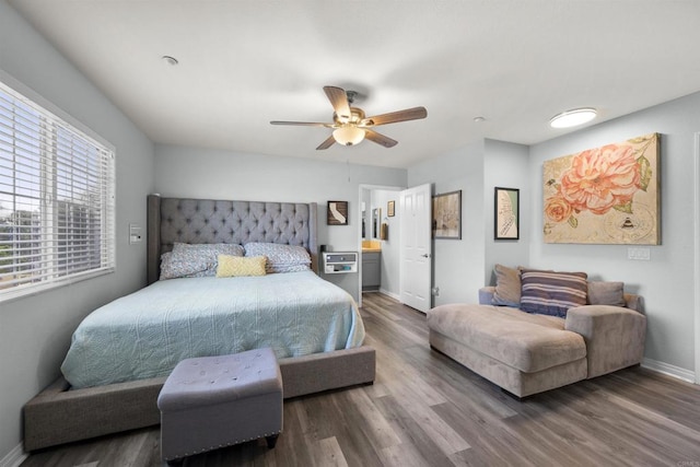bedroom featuring wood finished floors, baseboards, and a ceiling fan