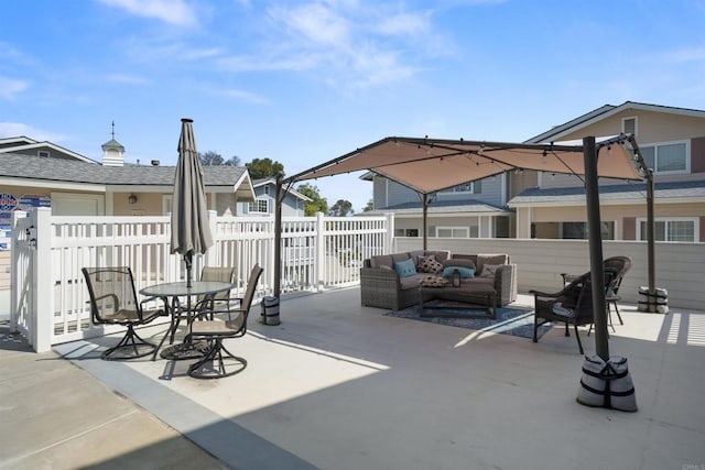 view of patio / terrace with an outdoor living space and fence