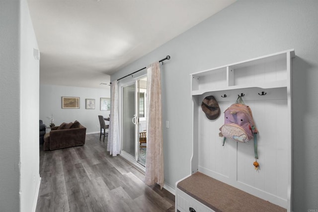 mudroom with wood finished floors and baseboards