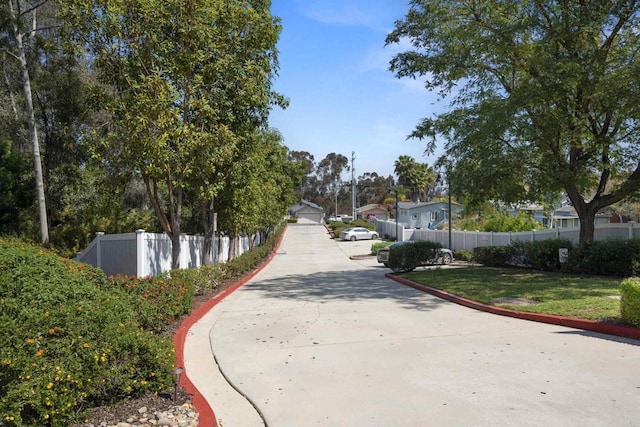 view of home's community with fence