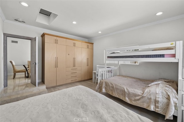 bedroom with recessed lighting, ornamental molding, and light wood-style floors
